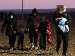 Freezing migrants are brought ashore at daybreak by RNLI days before Christmas