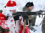 Russia’s National Guard wear Santa outfits as they lead young cadets on military manoeuvres