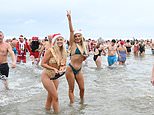 Festive swimmers brave chilly sea for their traditional Christmas Day dip