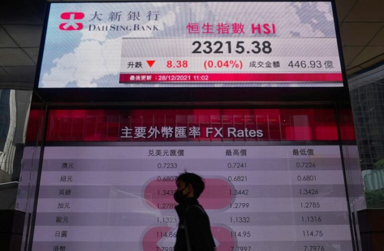Asian shares mostly slip amid lingering omicron worries