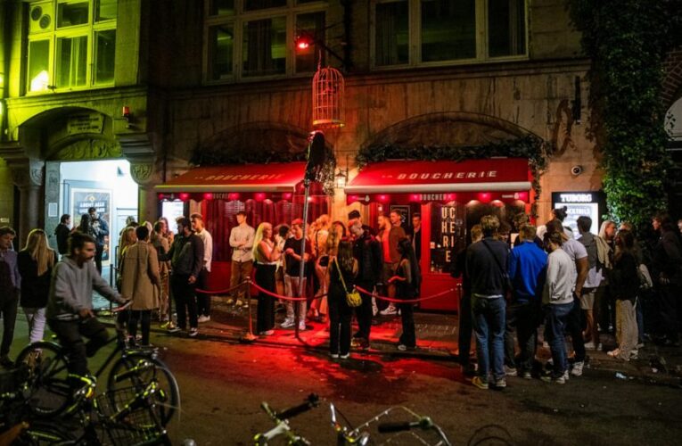 Denmark orders eateries to close early, bans large concerts