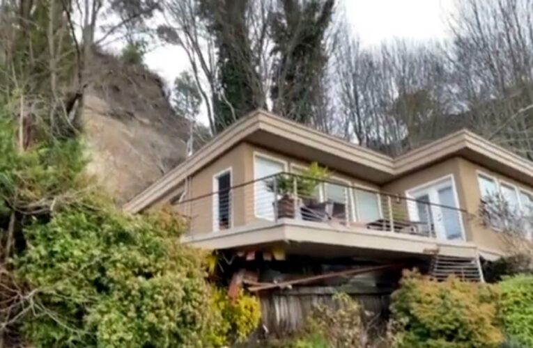 Man rescued after house slides off its foundation in Seattle following heavy rain