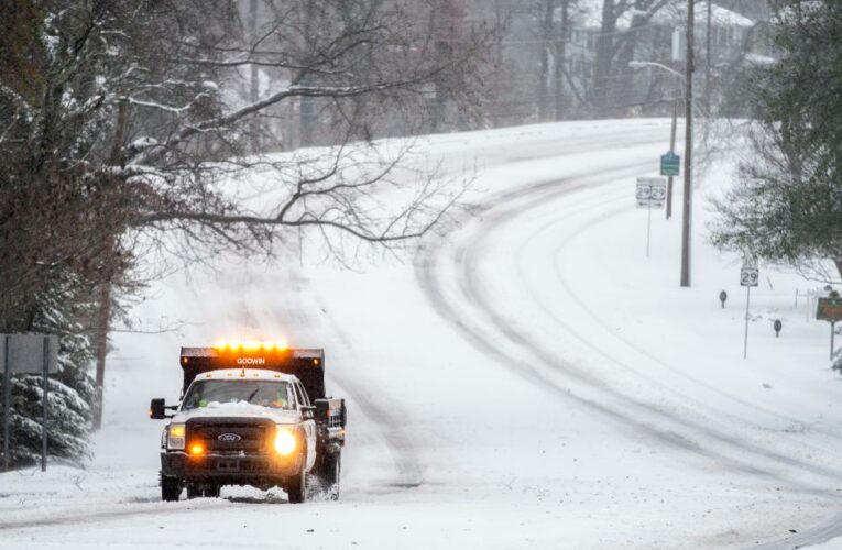 Guardsmen are assisting stranded motorists and more than 130,000 people are without power as snow and freezing rain pummel the area