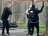 Masked thug hacks at officers in Croydon who battle to Taser him during horrific daylight assault
