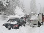 Twenty-two people DIE as epic snow storm leaves 125,0000 cars stranded in Pakistan