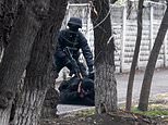 The crackdown Putin doesn’t want you to see: Masked Kazakh police pictured rounding up ‘protesters’