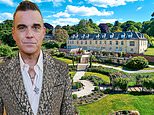 Robbie Williams FINALLY sells his £7million mansion after being forced to drop the asking price