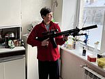 Ukrainian mother, 52, arms herself with a huge rifle amid threat of Russian invasion
