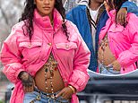 Rihanna is PREGNANT! Singer shows off bare baby bump in freezing NYC