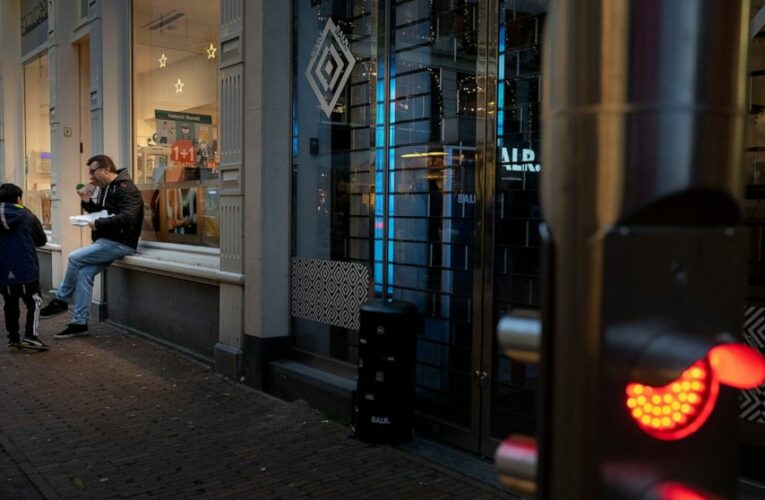 In southern Dutch town, cafes open in lockdown protest
