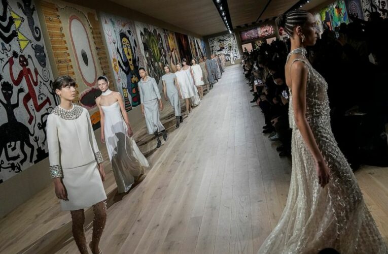 Dior celebrates couture craft, as maskless Delevingne irks