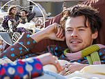 EXC: Harry Styles climbs into a BED to film his new music video