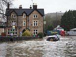 UK weather: Rivers burst their banks and train stations are left underwater