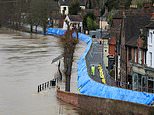 UK weather: Rivers burst their banks and train stations are left underwater