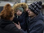 Mothers and children wave goodbye to loved ones they are forced to leave behind as they flee Ukraine