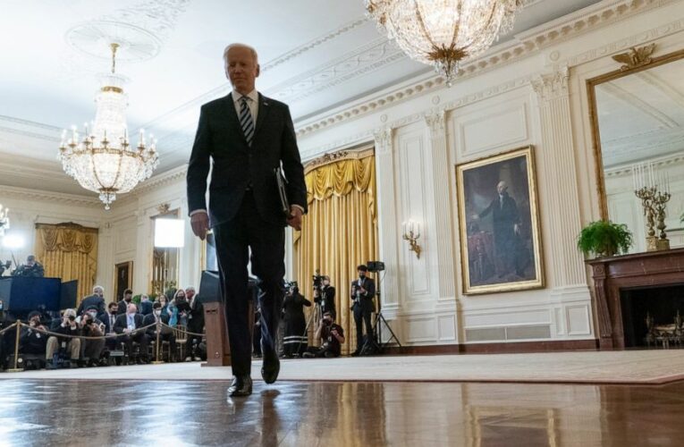 Biden hits Russia with sanctions, shifts troops to Germany