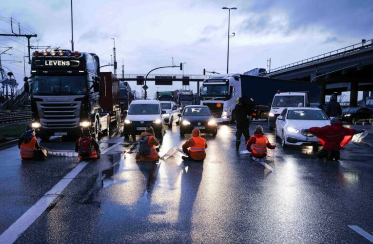 German officials condemn climate protests at roads, port