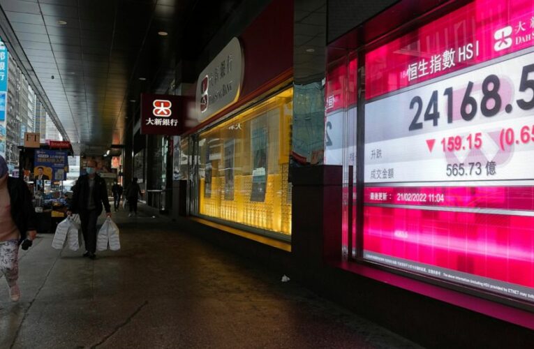 Asian shares mostly lower as investors eye Ukraine crisis