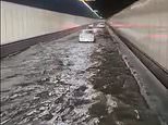 Terrifying footage shows Sydney’s M5 tunnel turning into a WATERSLIDE as it floods