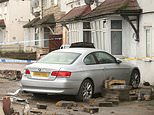 Pedestrian is killed as white BMW crashes into house in north-west London, as one man is arrested