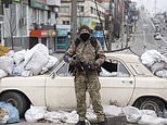 RICHARD PENDLEBURY: Brave residents vow ‘I will not leave’ Kyiv as Russian forces press on the city