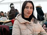 A helping hand for a tearful Ukrainian refugee who fled Russian bombing in Odesa 