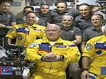 Three Russian cosmonauts wear Ukrainian colours during space mission