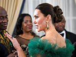 Kate glitters in emerald-and-diamond earrings and bracelet borrowed from the Queen