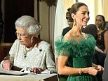 Kate glitters in emerald-and-diamond earrings and bracelet borrowed from the Queen
