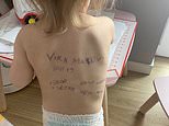 Ukrainian mother writes contact details on her child’s back in case her family is killed