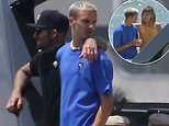 David Beckham wraps his arm around son Romeo, 19, as they relax on £5million yacht in Miami
