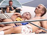 Romeo Beckham cuddles his girlfriend Mia Regan on £5million yacht in Miami