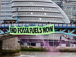 Eco mob CLOSE Tower Bridge: Activists ABSEIL to unfurl banner