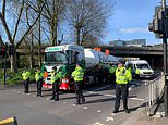 Eco mob cause rush hour chaos after clambering on top of Eddie Stobart fuel tanker