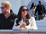 Prince Harry and Meghan Markle are flanked by five security guards at the Invictus Games