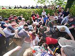 Fists fly and beer spills as villagers go to war in the annual Easter Monday ‘Bottle Kicking’