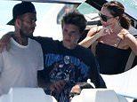 David Beckham gets a hug from Cruz as they join Victoria and Mia Regan for boat ride in Miami