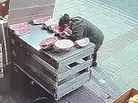 Woman takes a BITE out of a watermelon on display outside London greengrocers [Video]