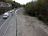 23 homes in Wales are flattened to muddy bank after residents paid to leave because of toxic fumes