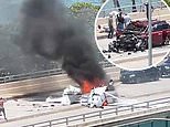 Two people are critically injured after small plane crashes on bridge in Miami 