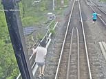 Moment three kids dodge death after ‘trying to RACE a train’ while playing on Toronto bridge