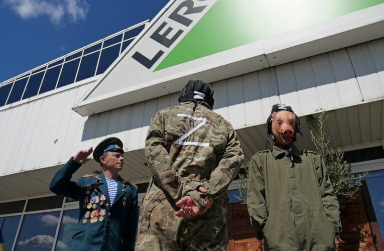 Protesters vent fury at French company for staying in Russia